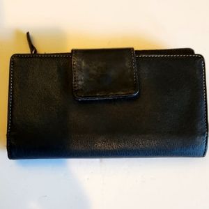 This is a vintage black leather bi‎ fold wallet